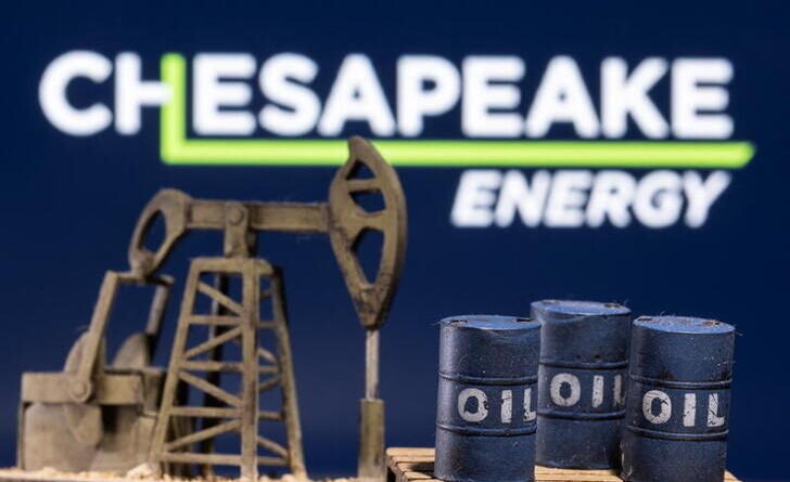 A 3D printed oil barrels and oil pump jack are seen in front of displayed Chesapeake Energy logo in this illustration taken January 25, 2022. REUTERS/Dado Ruvic/Illustration