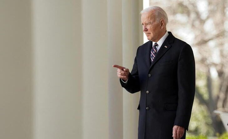 U.S. President Joe Biden enters the Rose Garden to sign into law H.R. 55, the